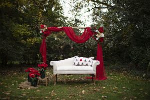 holiday christmas mini shoot, farmington hills, white couch, garland, red christmas tree blanket, christmas decor
