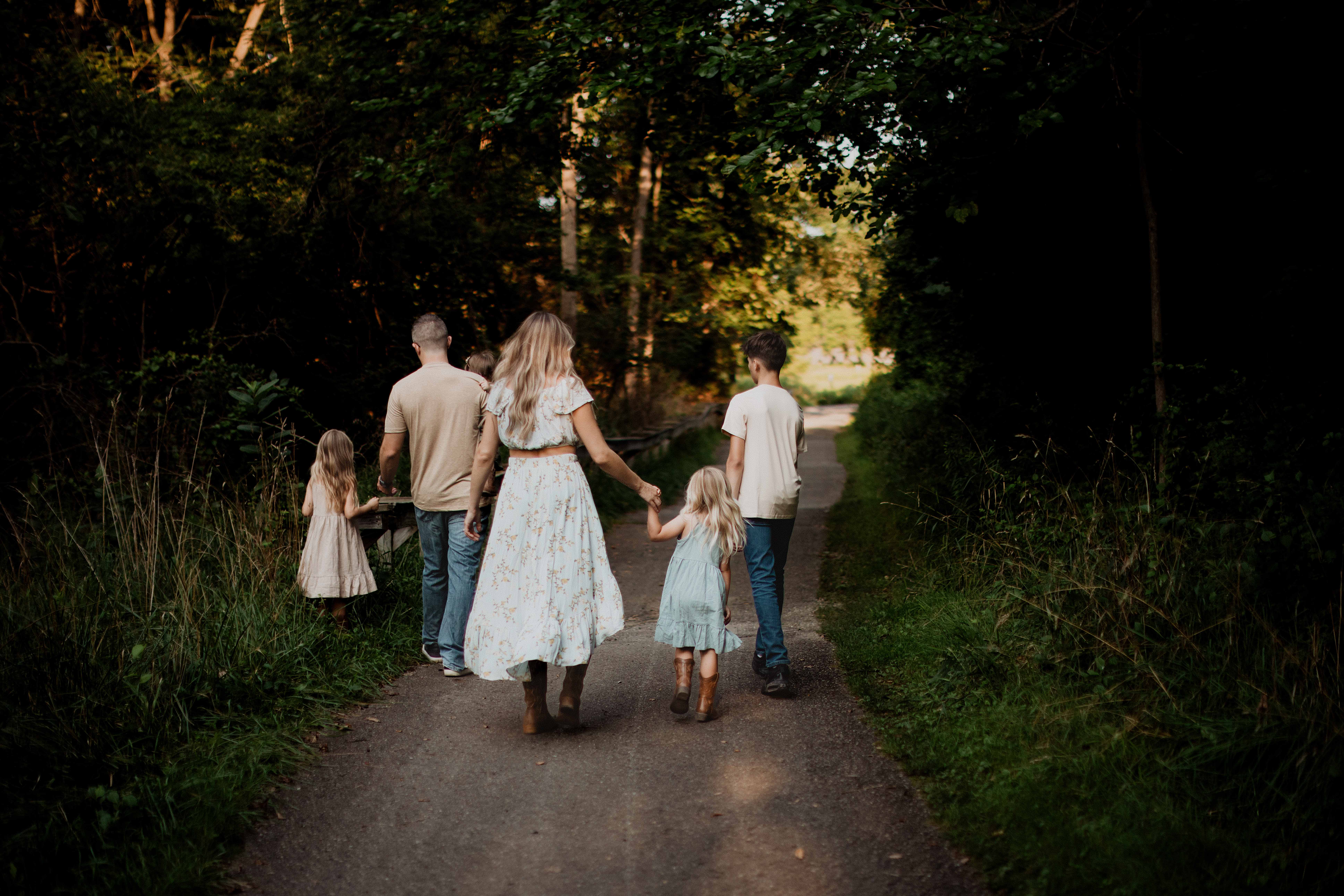 Family photo session at Heritage Park in Farmington Hills — kids playing on the swing surrounded by fall colors, captured by Detroit family photographer Michelle Ann.